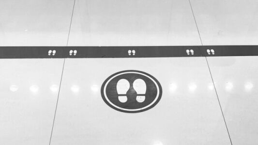 Social distancing signage put in place by Facility Managers during the COVID-19 Pandemic