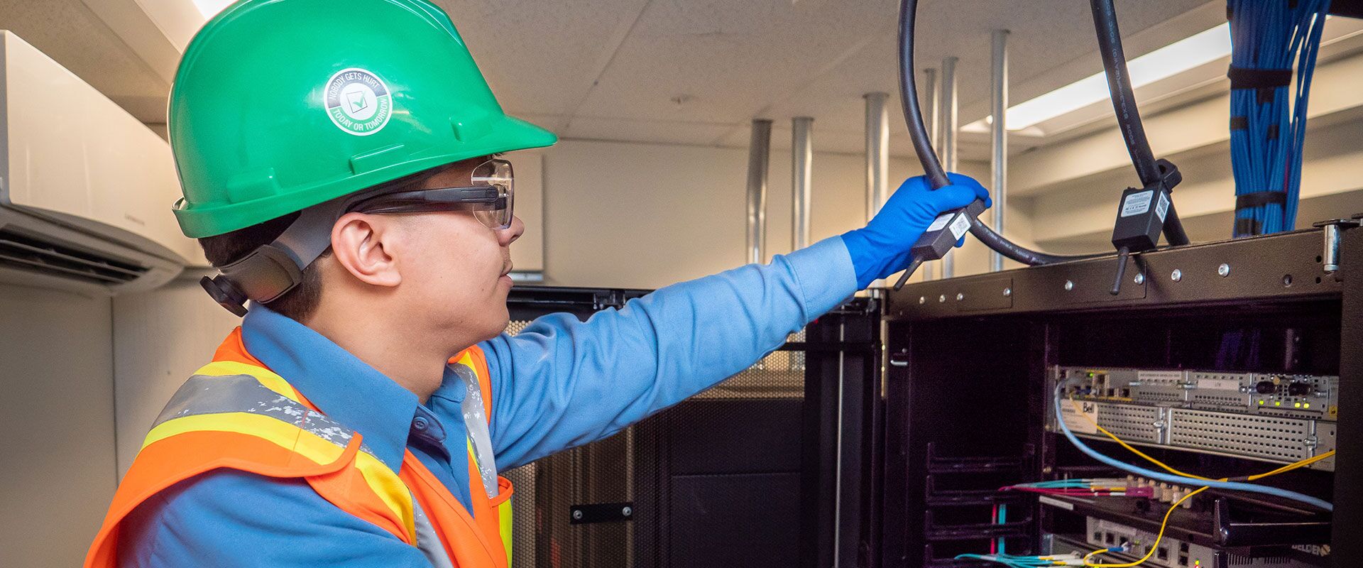 B&M's data and networking service technician doing quality check