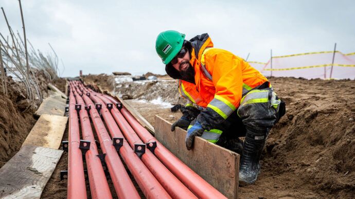 Black & McDonald skilled trade employee helping at a cabling construction project